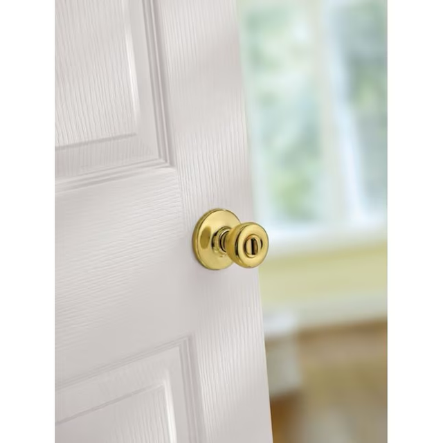 Kwikset Security Tylo - Pomo para puerta de privacidad de cama/baño de latón pulido